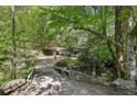 Secluded property featuring a home with mature trees at 3311 Stillhouse Se Rd, Atlanta, GA 30339