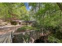 Secluded property featuring a home with mature trees at 3311 Stillhouse Se Rd, Atlanta, GA 30339