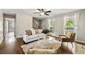 Inviting living area featuring hardwood floors, neutral tones, and comfortable seating at 385 Russell Ridge Dr, Lawrenceville, GA 30043