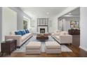 Bright living room featuring a fireplace, built-in shelving, and stylish furnishings on a patterned rug at 3423 Rugby Cir, Atlanta, GA 30337