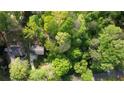 Aerial view of a home nestled among green, mature trees at 2520 Overlook Ne Way, Atlanta, GA 30345