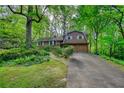 Charming two-story home with beautiful landscaping and an attached two-car garage at 2520 Overlook Ne Way, Atlanta, GA 30345