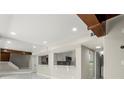 Open living space with a peek-through to the kitchen and stairs, with recessed lighting at 1009 Riverbend Club Se Dr, Atlanta, GA 30339