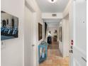 Entrance hallway with tile floors, light walls, and decoratively appointed side table at 5180 Chemin De Vie, Atlanta, GA 30342