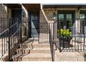 Inviting front entrance with brick steps, wrought iron railings, and attractive planters at 1059 Abington Ct, Brookhaven, GA 30319