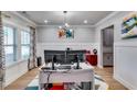 Bright home office with modern desk and stylish decor and large window at 3260 Summerpoint Xing, Cumming, GA 30028