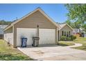 Spacious two-car garage with a long driveway offers convenience and ample parking space for residents and guests at 4719 Score Ct, Snellville, GA 30039