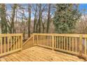 New wooden deck with railings and stairs offers a great outdoor space for relaxing or entertaining at 164 Polar Rock Sw Dr, Atlanta, GA 30315