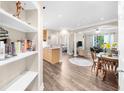 Open-concept space with hardwood floors, archways, and decorative shelving at 2103 Stratford Commons, Decatur, GA 30033