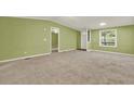 Inviting open-plan living room featuring a large window and neutral carpet at 4653 Anns Se Trce, Acworth, GA 30102