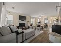 Cozy living room featuring a fireplace, neutral decor, and wood flooring with ample natural light at 536 Crestridge Ct, Stone Mountain, GA 30083
