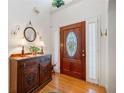 Charming entryway featuring a wooden front door and hardwood flooring at 7420 Colony Ct, Cumming, GA 30041