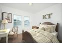 Cozy bedroom with natural light, neutral walls, and comfortable furnishings for a serene retreat at 7770 Sudbury Cir, Covington, GA 30014