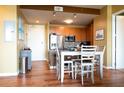 Eat-in kitchen features stainless appliances, stylish backsplash, and an island at 711 Cosmopolitan Ne Dr # 715, Atlanta, GA 30324