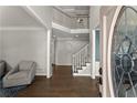 Grand foyer with hardwood floors, a staircase, and natural light at 3295 Millwood Se Trl, Smyrna, GA 30080