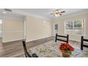 Spacious dining room featuring laminate flooring and a ceiling fan at 2700 Pine Tree Ne Rd # 1015, Atlanta, GA 30324