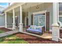Inviting front porch with a porch swing, perfect for enjoying the outdoors at 17 Brightwater Cv, Dallas, GA 30157