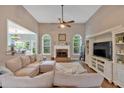 Bright living room featuring a fireplace, hardwood floors, and a cozy atmosphere at 17 Brightwater Cv, Dallas, GA 30157