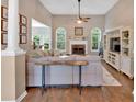 Bright living room featuring a fireplace, hardwood floors, and a cozy atmosphere at 17 Brightwater Cv, Dallas, GA 30157