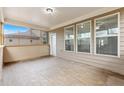 Enclosed back patio with neutral walls, and a ceiling fan at 4531 Claiborne Ct, Duluth, GA 30096