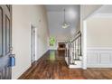 Spacious foyer with hardwood floors, high ceilings, and staircase at 1213 Blue Springs Dr, Loganville, GA 30052