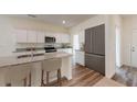 Modern kitchen with stainless steel appliances, granite countertops, and a center island at 14 Borland Rd, Villa Rica, GA 30180