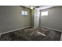Neutral bedroom with updated carpet, windows for natural light, and a ceiling fan at 103 Rigby Ne St, Marietta, GA 30060
