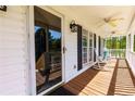 Relaxing covered porch with ceiling fans, rocking chairs, and plenty of space for outdoor seating at 208 Wellington Walk, Douglasville, GA 30134