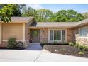 Attractive front entrance with a decorative door, stone accents, and a well-manicured garden at 3025 Greenfield Dr, Marietta, GA 30068