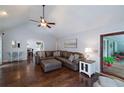 Spacious living room with hardwood floors, vaulted ceiling, and access to the back deck at 489 Warrenton Dr, Douglasville, GA 30134