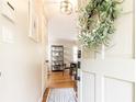 Welcoming entryway with hardwood floors, showcasing a glimpse into the dining area at 1295 Lindenwood Ne Ln, Brookhaven, GA 30319