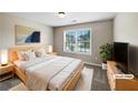Serene bedroom featuring a comfortable bed, stylish decor, and a bright window view at 400 Icicle Ct, Hampton, GA 30228