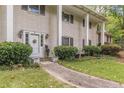 Charming home with a classic front door, white columns, and lush landscaping at 2985 Duke Of Gloucester, Atlanta, GA 30344