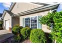Home exterior featuring siding, a window with shutters, and well-maintained landscaping at 320 Little Creek Rd, Lawrenceville, GA 30045