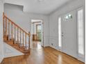 Inviting foyer with hardwood floors and staircase at 701 Belgrave Ln, Tucker, GA 30084