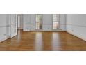 Spacious living room featuring gleaming hardwood floors and natural light at 701 Belgrave Ln, Tucker, GA 30084