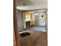 A partially renovated room, revealing the framework with yellow accent walls at 1099 Warren Dr, Riverdale, GA 30296