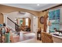 Inviting entryway with hardwood floors, an archway leading to the living room, and an abundance of natural light at 1705 Butler Bridge Rd, Covington, GA 30016