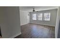 Bright living room with wood floors, large windows, and neutral paint at 2825 Northeast Expy # F 03, Atlanta, GA 30345
