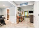 Inviting living room area with tile floors and warm light spilling in at 1850 Brooks Pointe Ct, Lawrenceville, GA 30045