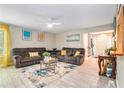 Relaxing living room with tile floors, recessed lighting, and a large window offering ample light at 1850 Brooks Pointe Ct, Lawrenceville, GA 30045