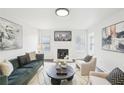 Inviting living room with fireplace, modern furniture, and plenty of natural light at 2201 Huntingdon Chase St, Atlanta, GA 30350