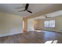 Spacious living room featuring hardwood floors, ceiling fans, and abundant natural light at 4210 Pepperdine Dr, Decatur, GA 30034