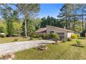 Charming home featuring a well-manicured yard and inviting driveway at 2520 Hartford Dr, Ellenwood, GA 30294