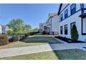 Beautifully landscaped yard with walkway, fencing, and view of the home exterior at 3364 Old Concord Se Rd, Smyrna, GA 30082