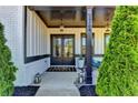 Inviting front entrance with double doors, lanterns, and charming exterior details at 3364 Old Concord Se Rd, Smyrna, GA 30082