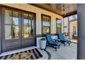 Charming front porch with seating area, double doors, and classic design elements at 3364 Old Concord Se Rd, Smyrna, GA 30082
