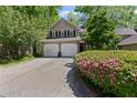 Charming two-story home featuring a two-car garage, well-maintained landscaping, and inviting curb appeal at 403 S River Farm Dr, Alpharetta, GA 30022