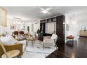 Open-concept living space with modern decor, hardwood floors, and bright natural light from ample windows at 830 Belgrade Ne Ave, Atlanta, GA 30306
