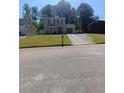 Charming two-story home with manicured lawn and attached garage at 2044 Mallard Crest, Lithonia, GA 30058
